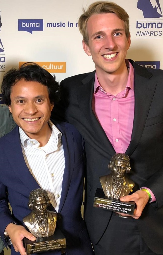 Two composers holding Buma Award trophies at the awards ceremony